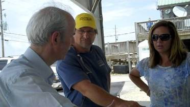 George Nicolaides speaks to reporters in Louisiana.